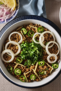 Smoky Dum Keema – Pakistani smoked mince curry garnished with fresh coriander and ginger