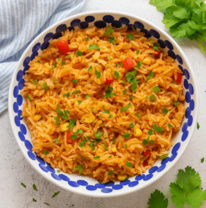 Homemade Peri Peri Rice served in a bowl with Nando’s-style spicy seasoning and fresh parsley garnish