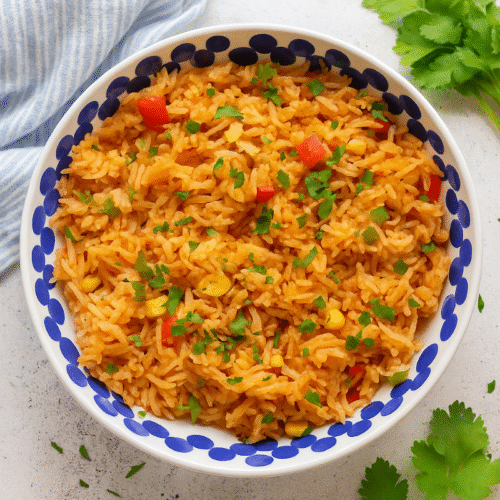 Homemade Peri Peri Rice served in a bowl with Nando’s-style spicy seasoning and fresh parsley garnish