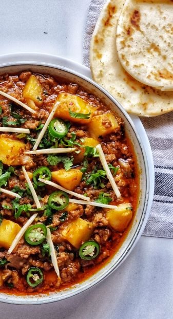 Authentic Aloo Keema (Mincemeat and Potato Curry) served with naan 