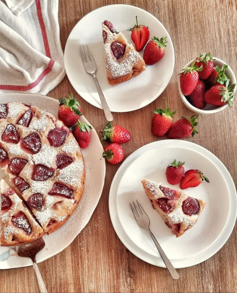 Fresh Strawberry cake slices served along with fresh strawberries