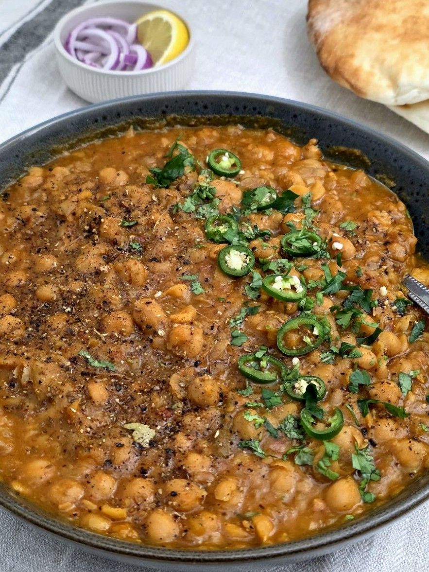 Bowl of Chana Masala with tender chickpeas in spiced tomato-onion gravy