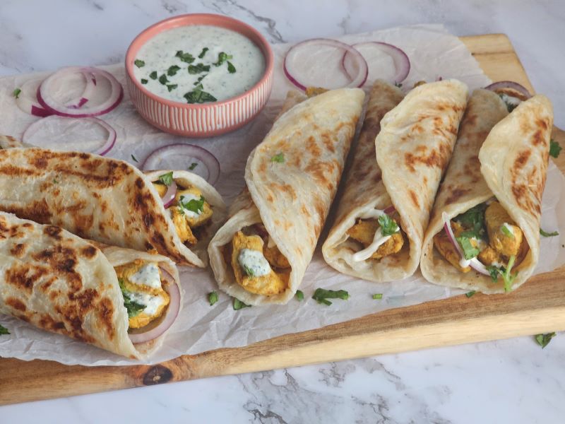 Spicy Chicken paratha roll wrapped in Flaky Paratha