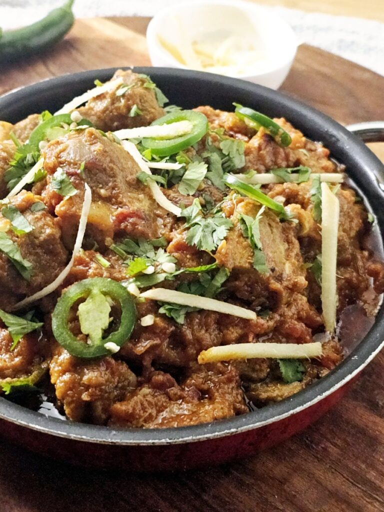 Traditional Karahi Gosht with tender goat meat and rich tomato-based gravy