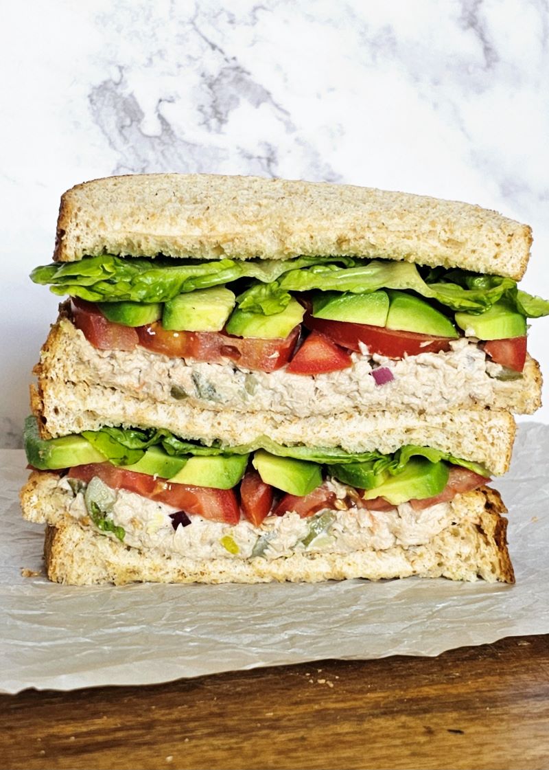 Tuna and avocado sandwich with tomatoes and lettuce
