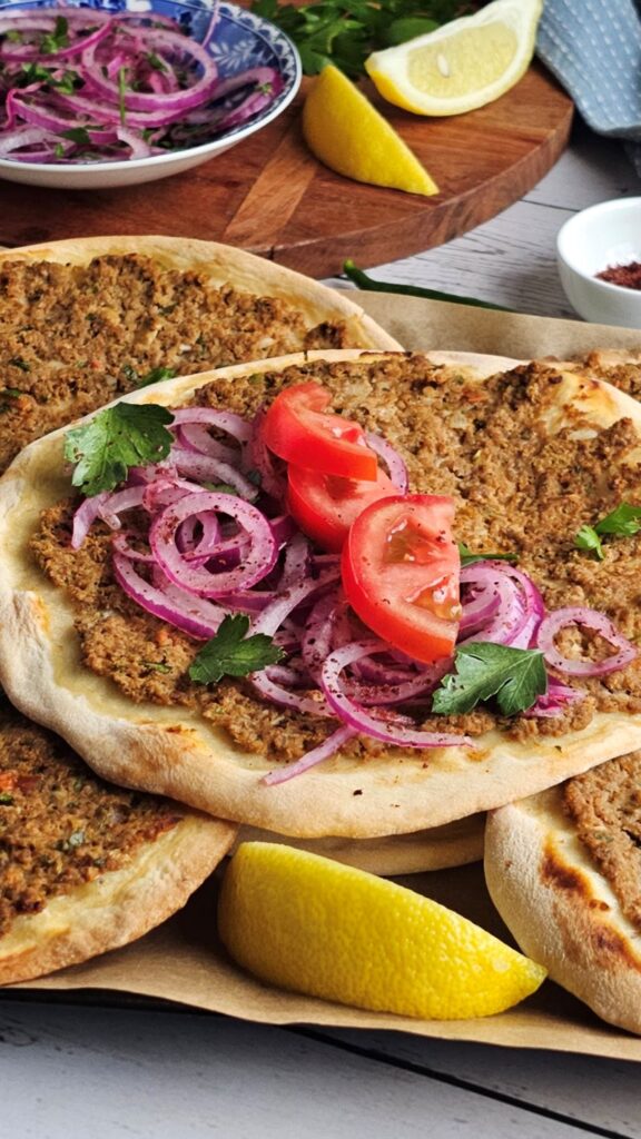 Turkish flat bread with Mince Meat Topping served with onions and tomatoes