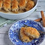 Shredded phyllo rolled with walnuts and doused in sygar syrup.