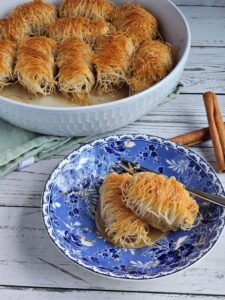 Shredded phyllo rolled with walnuts and doused in sygar syrup.