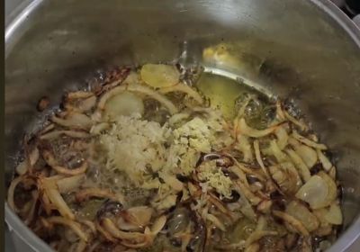 Sliced onions and garlic ready for slow-cooked Beef Nihari