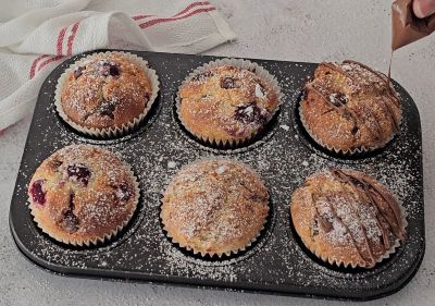 Chocolate drizzle on raspberry chocolate chip muffin